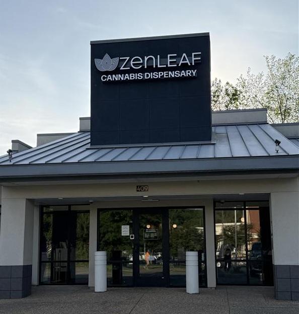 Exterior storefront of a Zen Leaf cannabis dispensary with branded signage above the entrance in Williamsburg, Virginia.